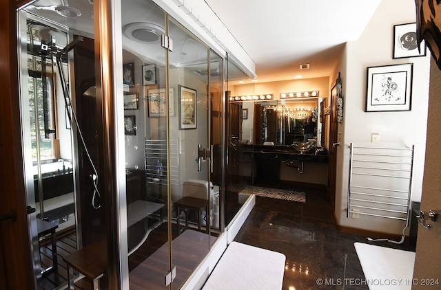 bathroom with wood-type flooring