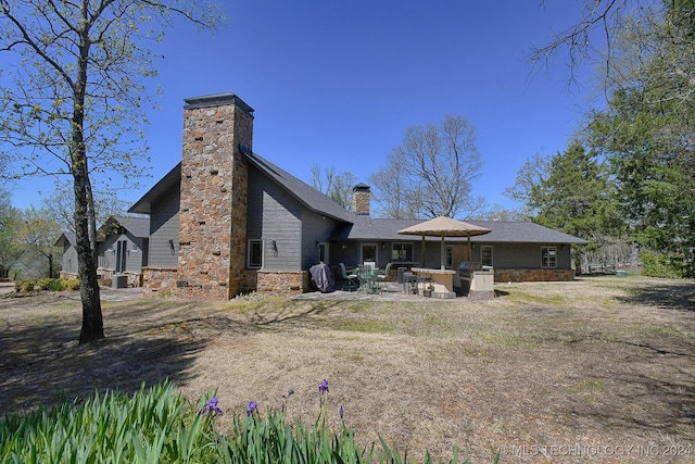 rear view of house with a patio