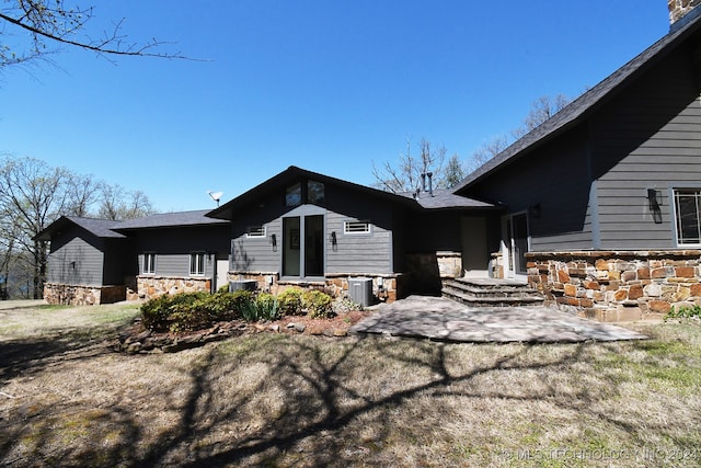 exterior space with a patio and central air condition unit