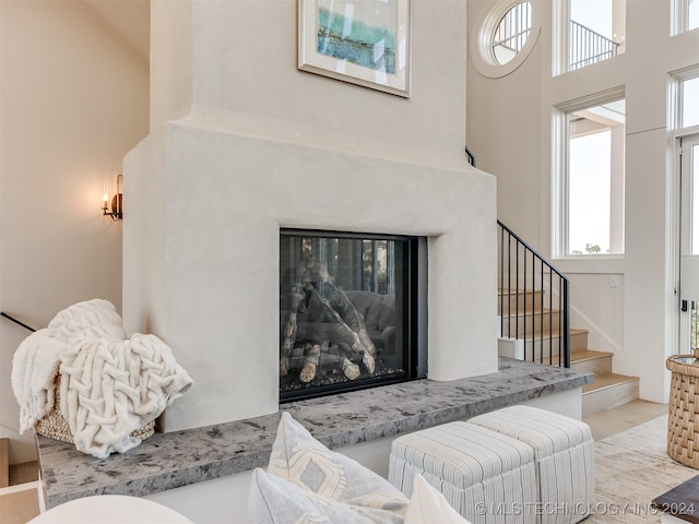 living room with a towering ceiling