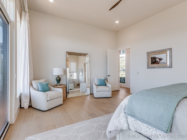 bedroom with light hardwood / wood-style flooring and ceiling fan