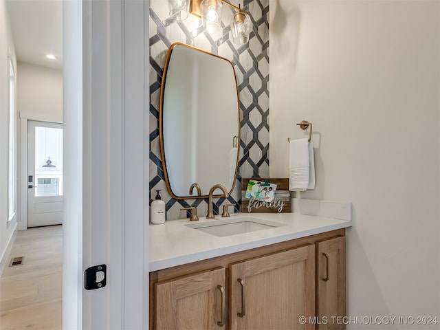 bathroom featuring vanity and wood-type flooring