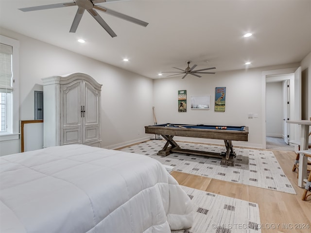 bedroom featuring light hardwood / wood-style flooring, billiards, and ceiling fan