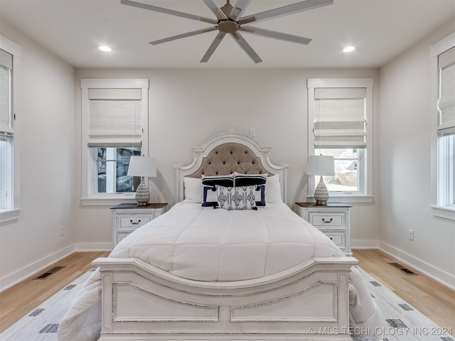 bedroom featuring light wood-type flooring and ceiling fan