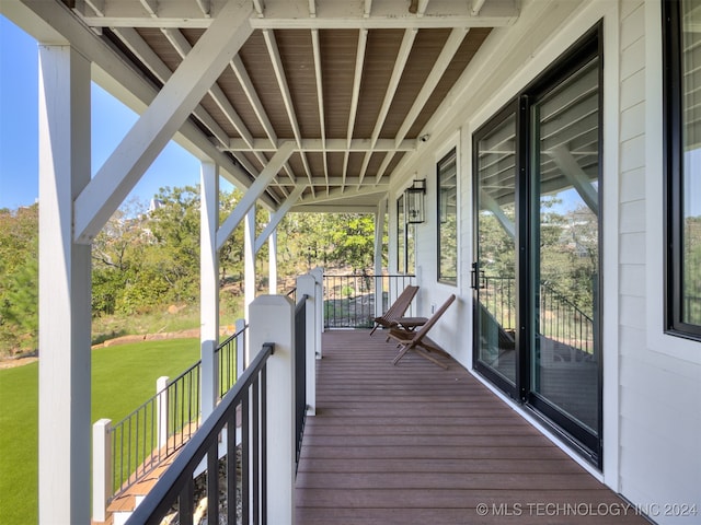 unfurnished sunroom with plenty of natural light