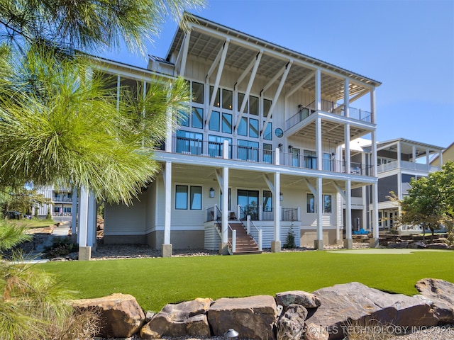 exterior space featuring a yard and a balcony