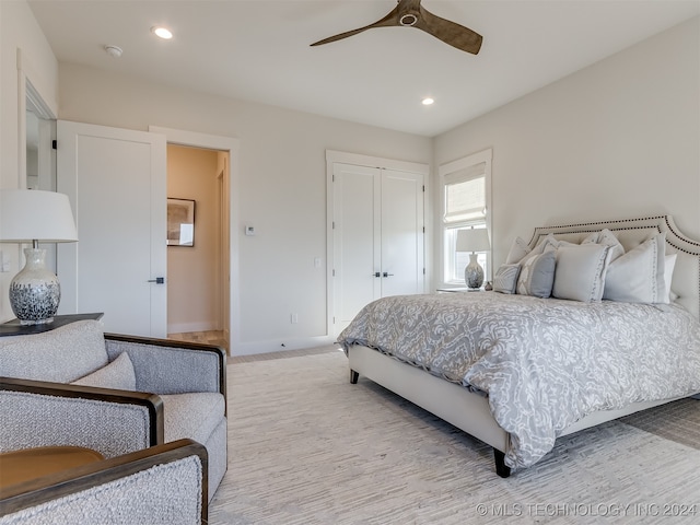 carpeted bedroom featuring ceiling fan