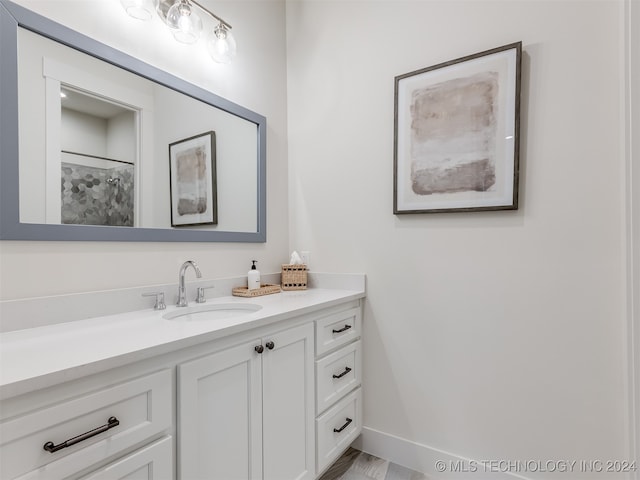 bathroom featuring vanity and hardwood / wood-style flooring