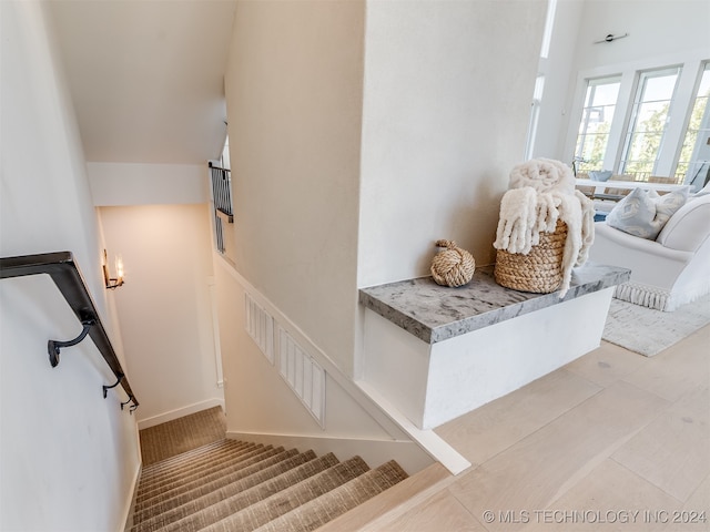 stairs with tile patterned floors