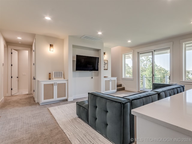 living room featuring light colored carpet