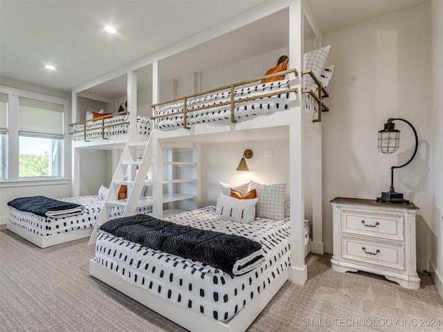 bedroom featuring light colored carpet