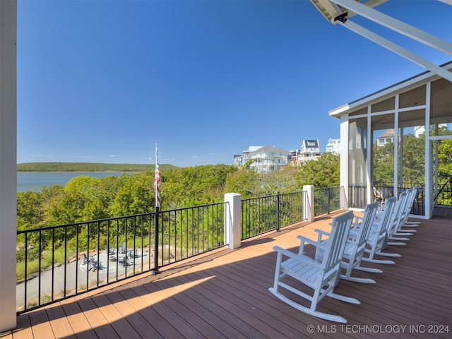 wooden deck with a water view