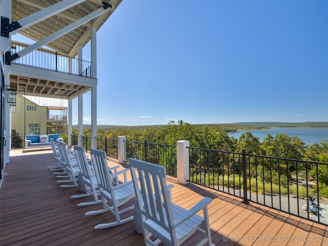 wooden terrace with a water view