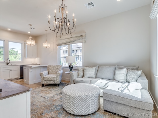 living room featuring light hardwood / wood-style floors and sink