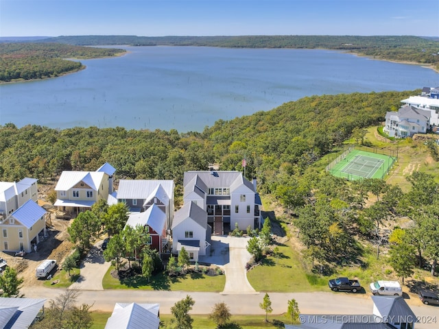 birds eye view of property with a water view