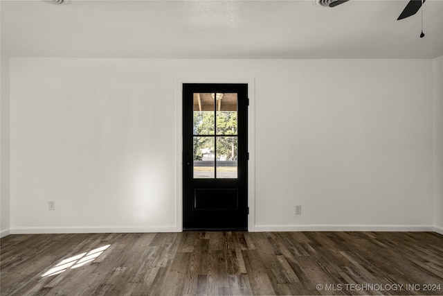 interior space with ceiling fan and dark hardwood / wood-style flooring