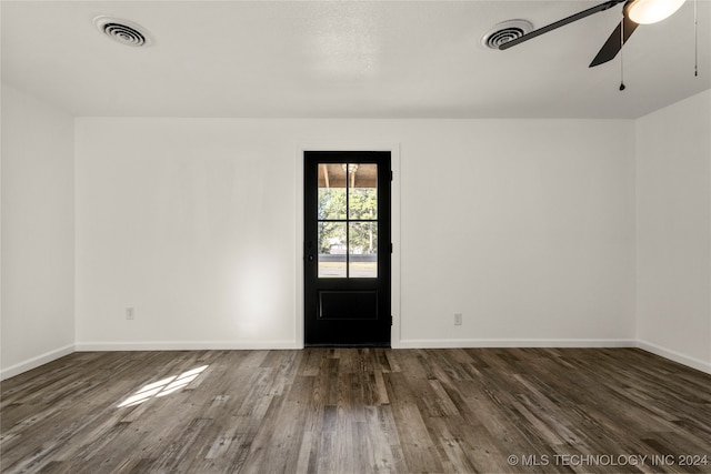 entrance foyer with ceiling fan and dark wood-type flooring