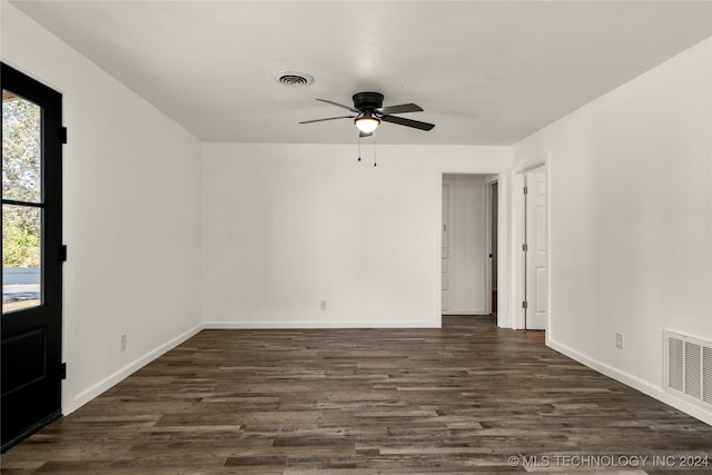 unfurnished room with ceiling fan and dark wood-type flooring