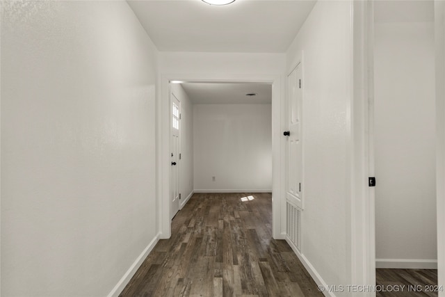 hall with dark hardwood / wood-style floors