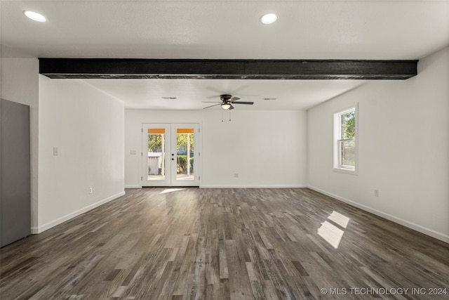 unfurnished living room featuring french doors, dark hardwood / wood-style flooring, plenty of natural light, and beam ceiling