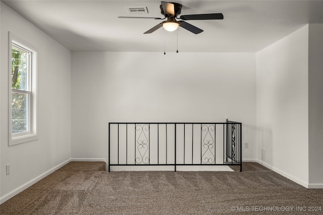 carpeted empty room with ceiling fan