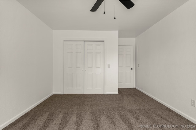 unfurnished bedroom with carpet flooring, ceiling fan, and a closet