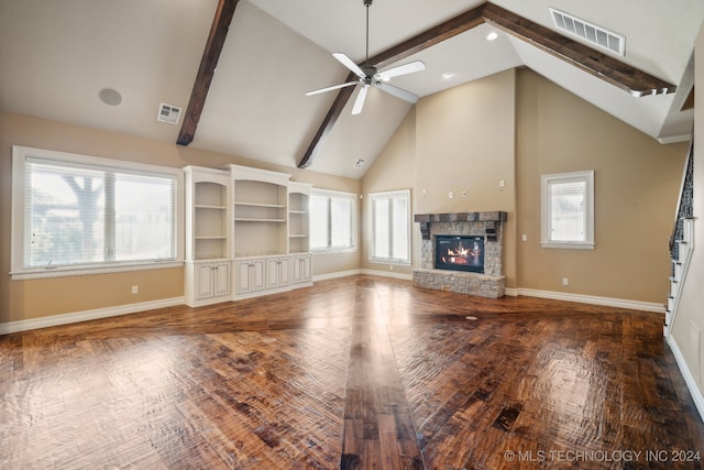 unfurnished living room featuring a fireplace, dark hardwood / wood-style floors, high vaulted ceiling, and a healthy amount of sunlight