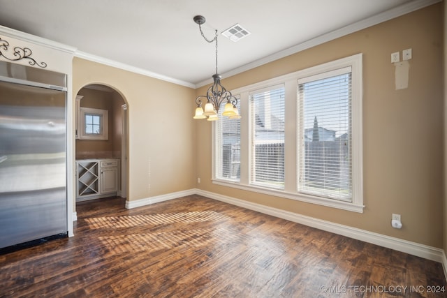 unfurnished dining area with a notable chandelier, crown molding, and dark hardwood / wood-style flooring