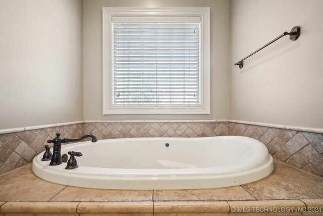 bathroom with a tub to relax in