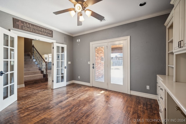 doorway featuring ornamental molding, ceiling fan, french doors, and dark hardwood / wood-style flooring