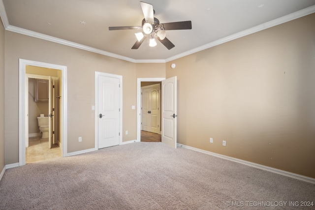 unfurnished bedroom featuring ceiling fan, light colored carpet, and crown molding