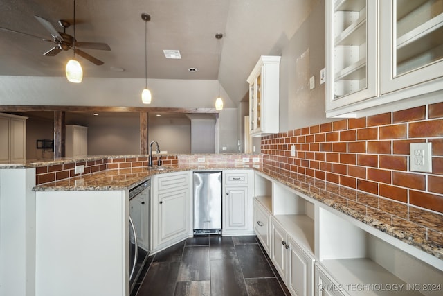 kitchen featuring decorative light fixtures, kitchen peninsula, and white cabinetry