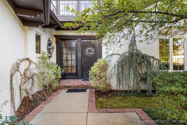 property entrance with a balcony