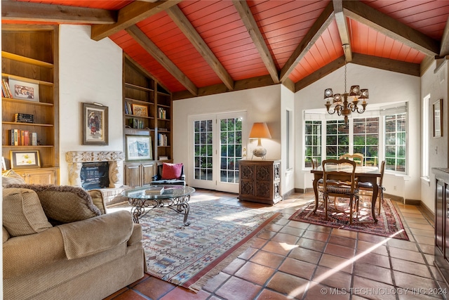 tiled living room with high vaulted ceiling, a wealth of natural light, and built in features