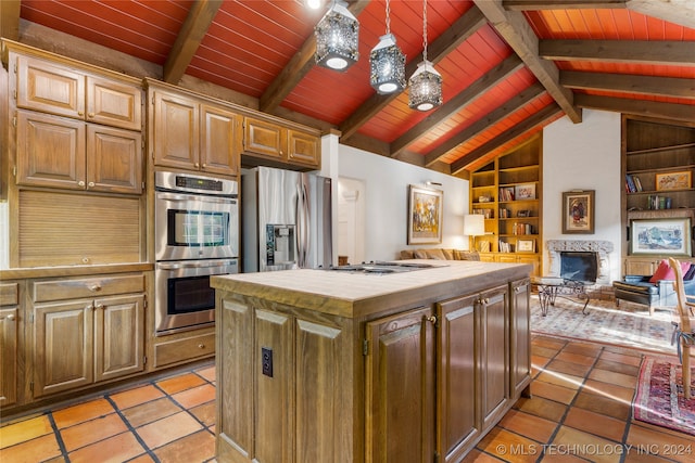 kitchen featuring lofted ceiling with beams, stainless steel appliances, a center island, decorative light fixtures, and built in shelves