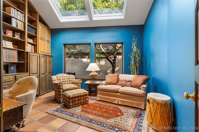 sitting room with lofted ceiling with skylight