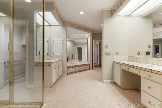 bathroom with crown molding, vanity, and separate shower and tub