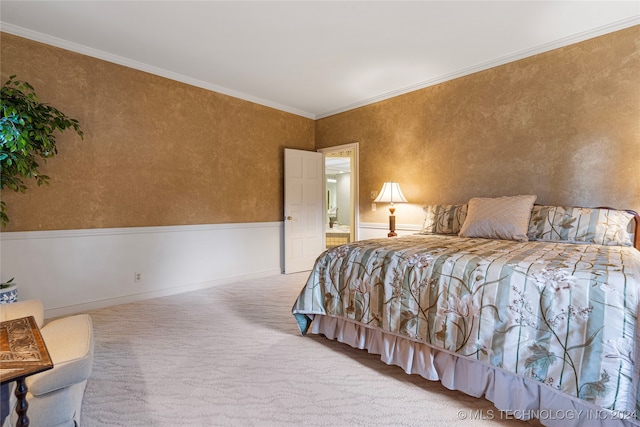 carpeted bedroom with ornamental molding