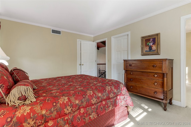 bedroom with light colored carpet and crown molding