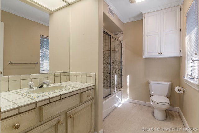 full bathroom with tasteful backsplash, vanity, crown molding, combined bath / shower with glass door, and toilet