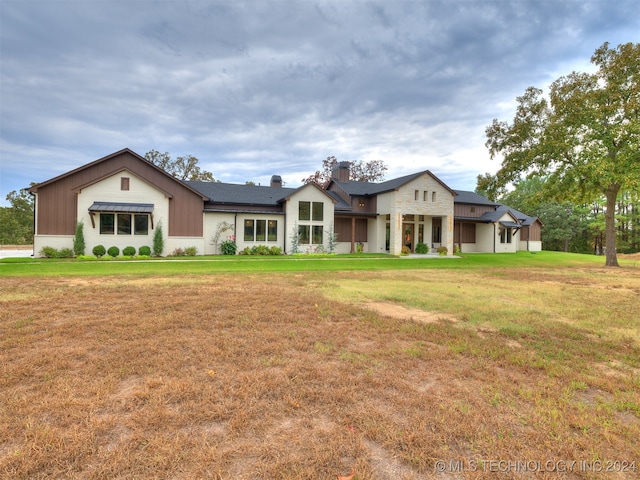 view of front of home with a front yard