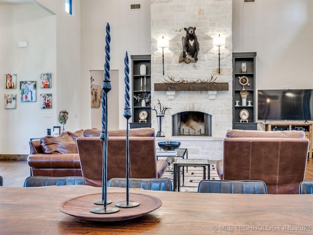 living room featuring a stone fireplace