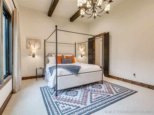 carpeted bedroom featuring beamed ceiling and an inviting chandelier