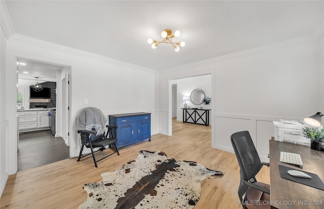 office space featuring an inviting chandelier, crown molding, and light hardwood / wood-style floors