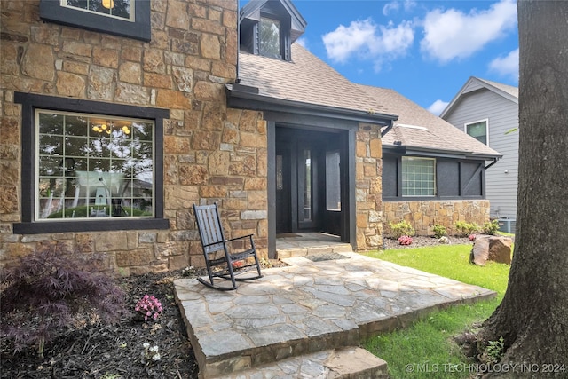 doorway to property with a patio