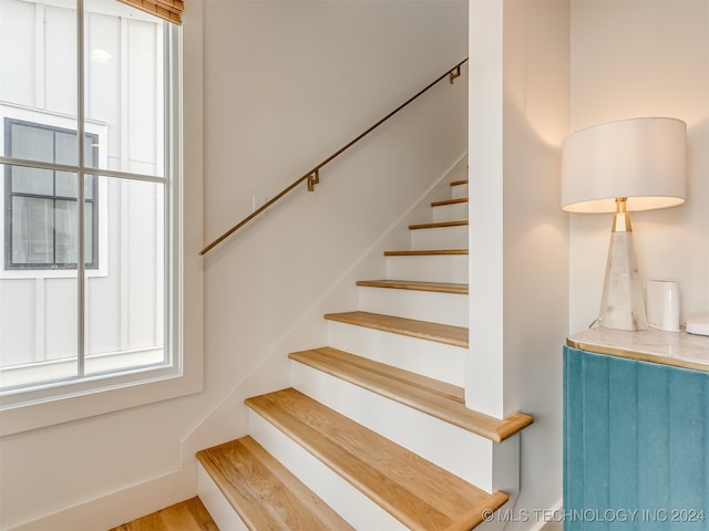 staircase featuring hardwood / wood-style floors