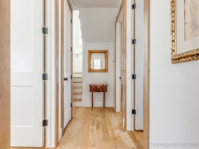 corridor featuring light hardwood / wood-style floors