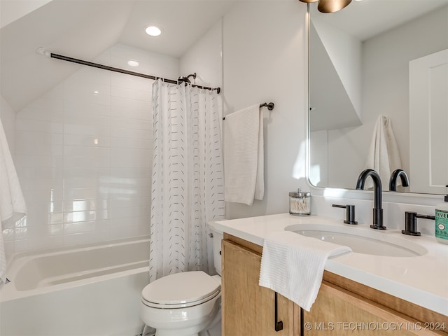 full bathroom with shower / bath combo, vanity, and toilet