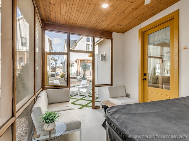 sunroom with wooden ceiling