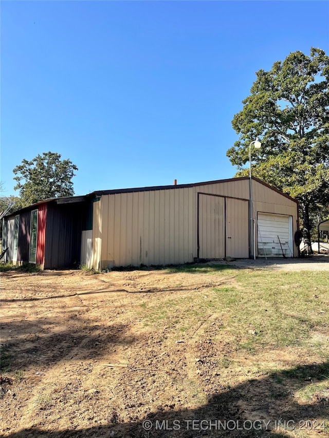 view of outdoor structure featuring a garage